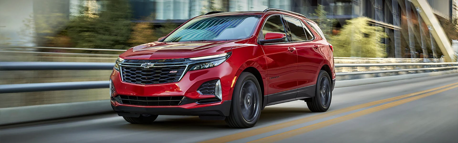 A 2022 Chevrolet Traverse driving along a scenic road.