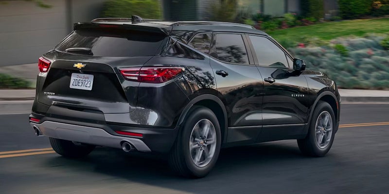 A 2024 Chevrolet Blazer driving along a scenic road.