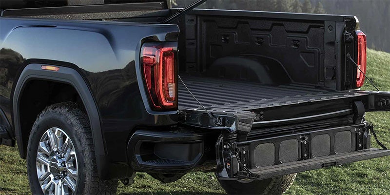 Rear view of a black truck featuring a bed cover