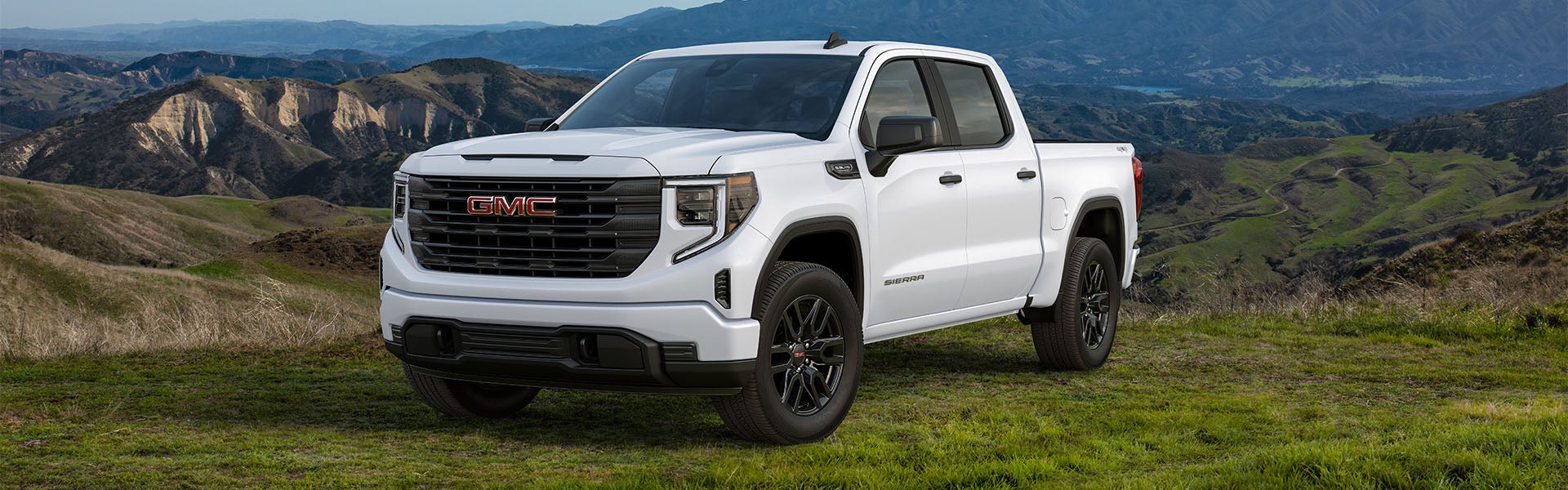 A white 2024 GMC Sierra 1500 parked.